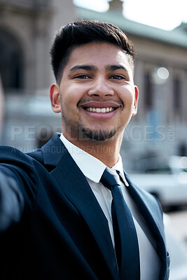 Buy stock photo Portrait, lawyer and selfie of business man in city, smile and taking photo for social media in urban street. Face, smile and profile picture of professional, entrepreneur or male attorney from India