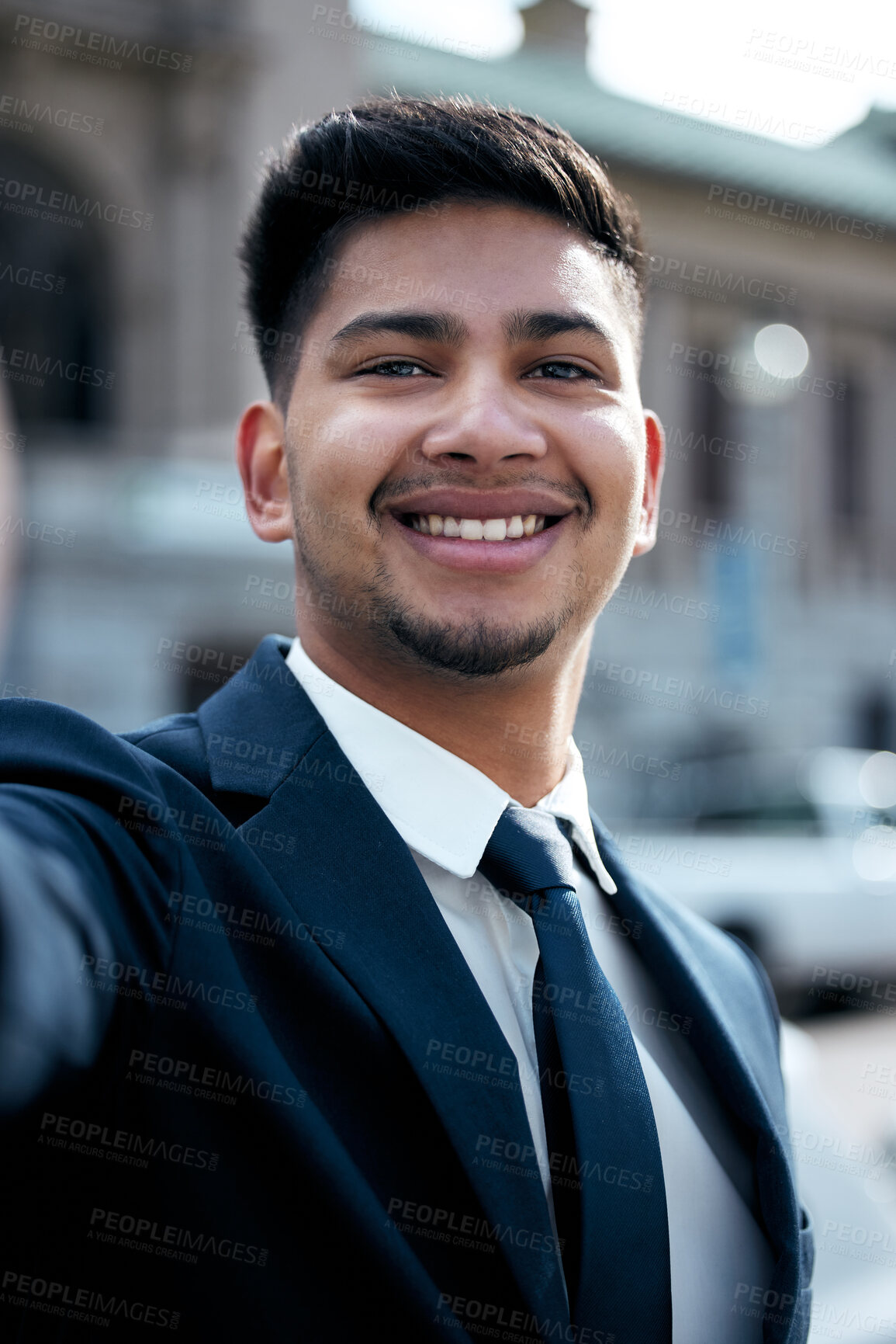 Buy stock photo Portrait, lawyer and selfie of business man in city, smile and taking photo for social media in urban street. Face, smile and profile picture of professional, entrepreneur or male attorney from India