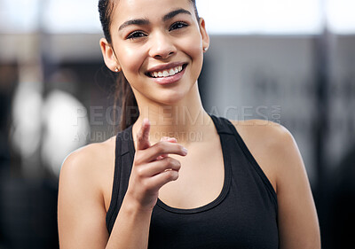 Buy stock photo Portrait, girl and pointing in gym, smile and fitness with training, health and recruitment to club. Promotion, you and happiness of athlete, choice and offer for wellness, sportswear and exercise