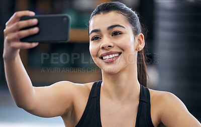 Buy stock photo Selfie, smile and girl in gym, sportswear and training for health, strong and muscle for profile picture. Social media, athlete and woman with phone, happiness and workout in club, exercise and face