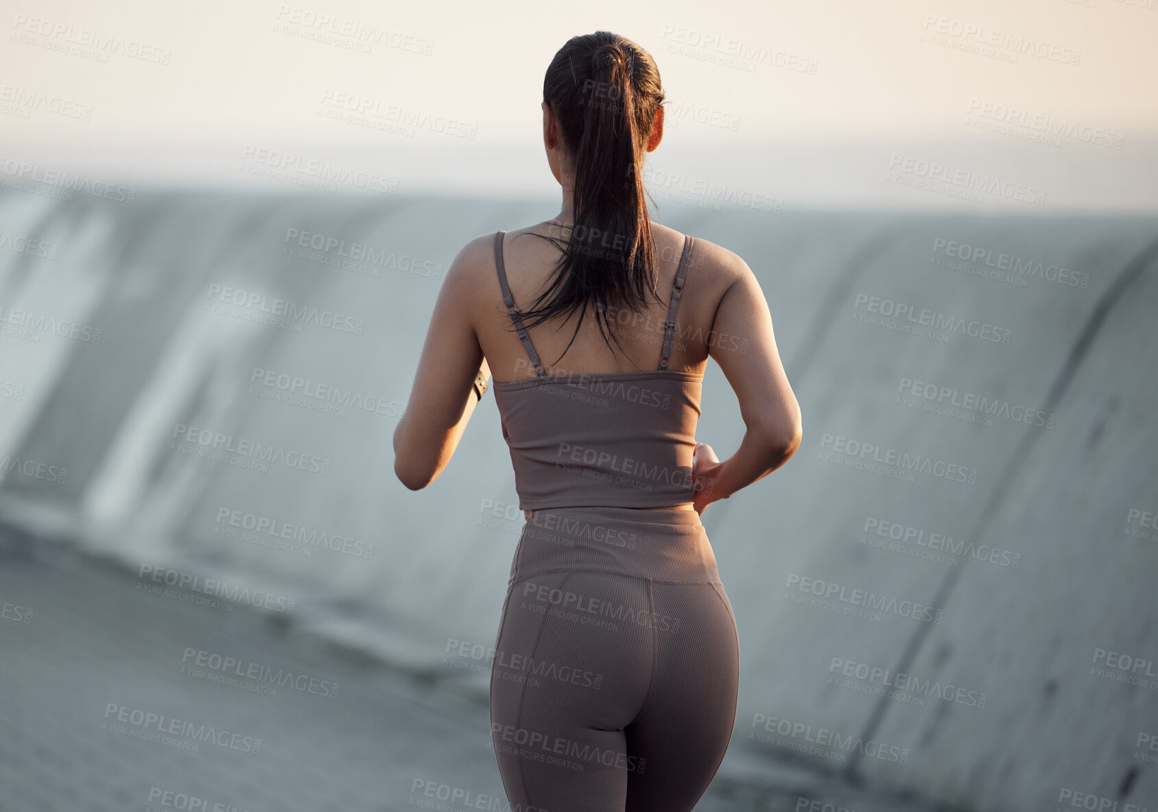 Buy stock photo Fitness, running and woman in outdoor exercise in body health, energy or wellness from back. Workout, commitment and girl runner with dedication to morning marathon training, performance or cardio