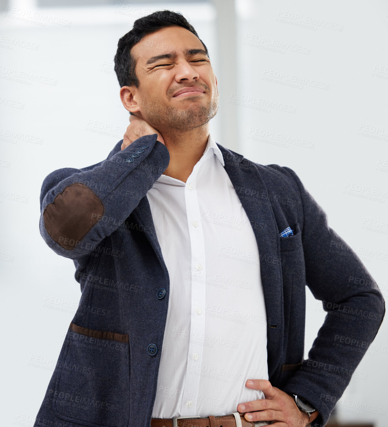 Buy stock photo Accident, neck pain and injury with a business man standing hand on hip in his office while working. Medical, healthcare and anatomy with a male employee holding his stiff shoulder in the workplace