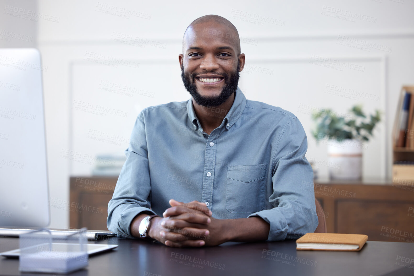 Buy stock photo Happy, desk and portrait of black man entrepreneur in corporate company or agency office arms crossed. Professional, African and young person or employee ready for business development with a smile