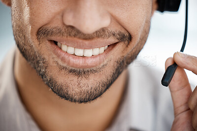 Buy stock photo Shot of a unrecognizable male smiling and working with a headset at work