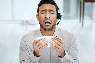Buy stock photo Man, sick and cold at call center with headset or tissue sneeze for customer support, telemarketing or allergy. Asian person, burnout and immune virus for bacteria or tech service, helping or illness
