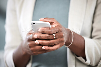 Buy stock photo Phone, hands and closeup of a businesswoman browsing on social media or the internet. Technology, communication and female employee typing or networking on a mobile app with a cellphone in workplace.