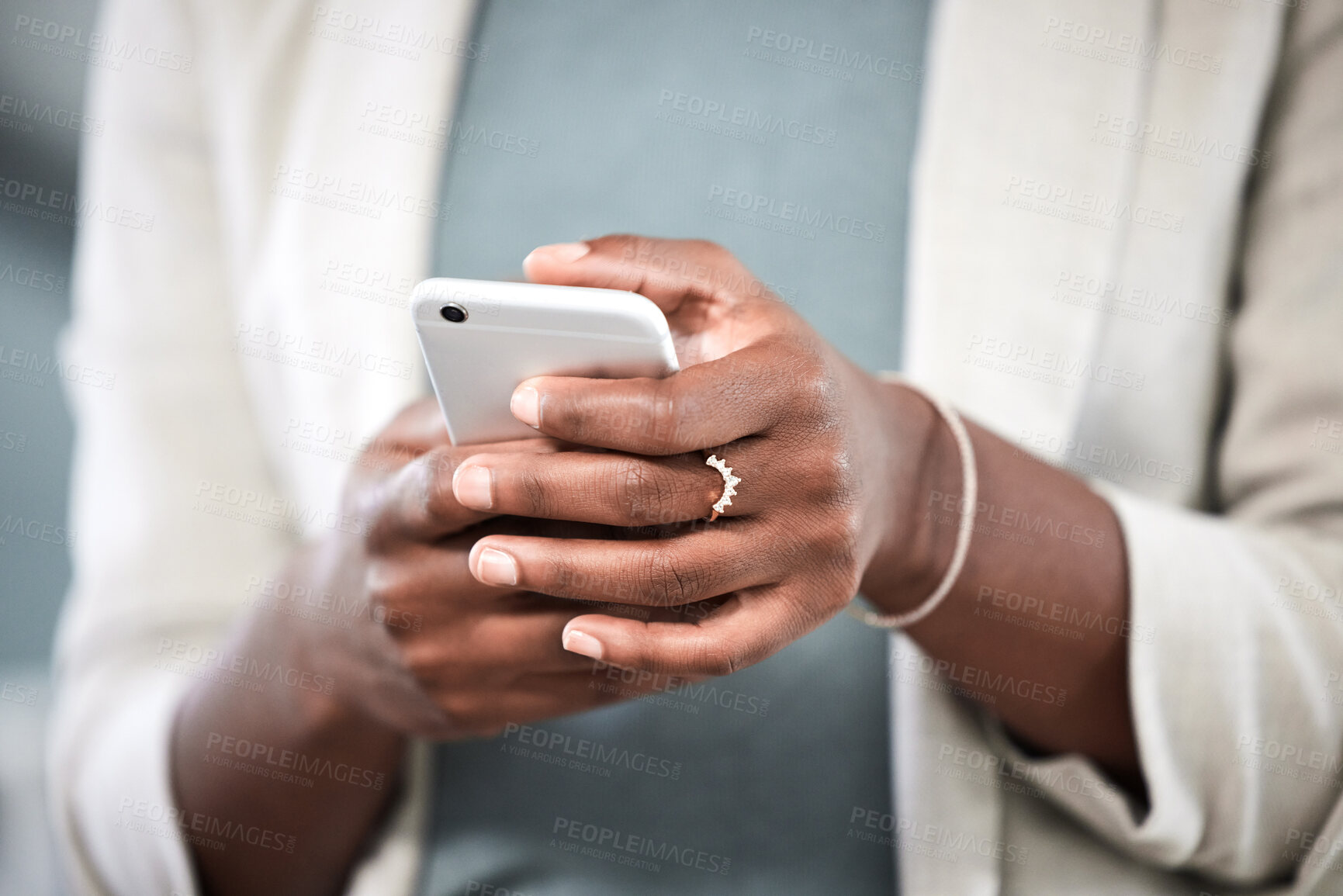 Buy stock photo Phone, hands and closeup of a businesswoman browsing on social media or the internet. Technology, communication and female employee typing or networking on a mobile app with a cellphone in workplace.