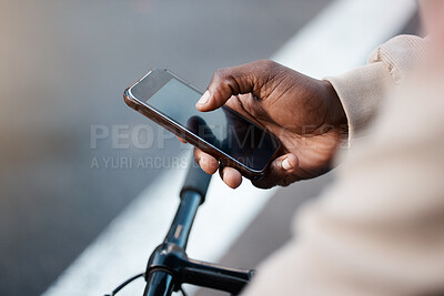 Buy stock photo Man, hands and phone with screen on bicycle for social media, communication or networking on mockup in city. Closeup of male person typing or texting on bike with mobile smartphone in an urban town