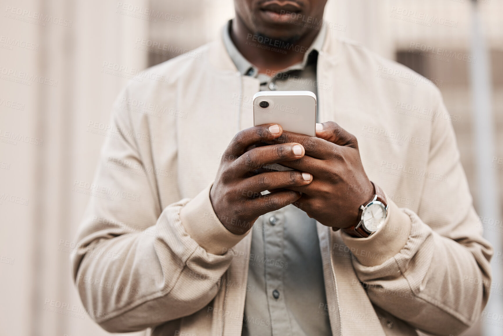 Buy stock photo Shot of a businessman using his smartphone to send a text