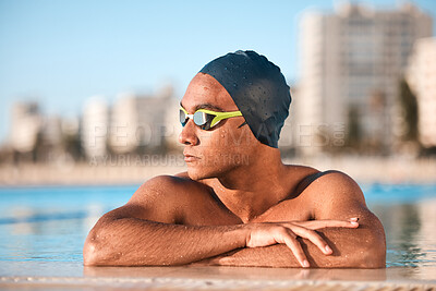 Buy stock photo Shot of a handsome young male athlete swimming in an olympic-sized pool