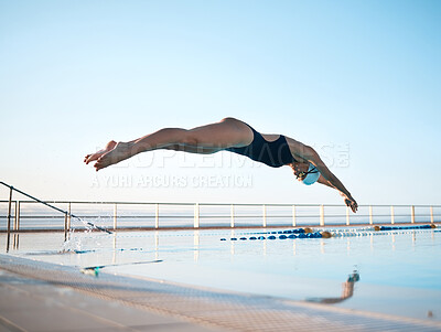 Buy stock photo Shot of an unrecognizable young female athlete swimming in an olympic-sized pool