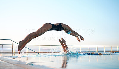 Buy stock photo Shot of two young athletes diving into an olypmic-sized swimming pool