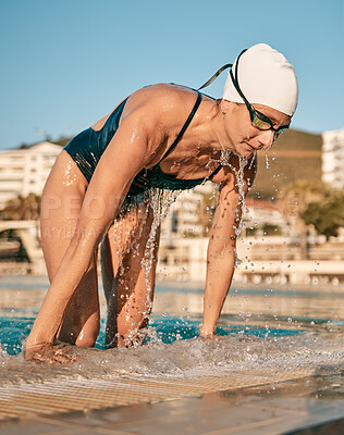 Buy stock photo Shot of a young female athlete swimming in an olympic-sized pool