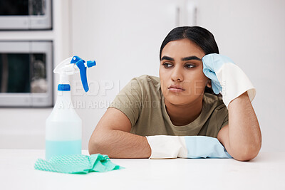 Buy stock photo Bored, spray bottle and woman with gloves in kitchen for cleaning, housekeeping and hygiene service. Burnout, tired and female cleaner with detergent and cloth by counter for routine at home.