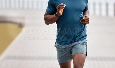 Buy stock photo Closeup shot of an unrecognisable man running outdoors