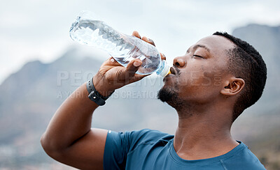 Buy stock photo Drinking water, fitness and black man in nature for exercise, marathon training and running outdoors. Sports, workout and thirsty male person rest to drink liquid for hydration, wellness and health