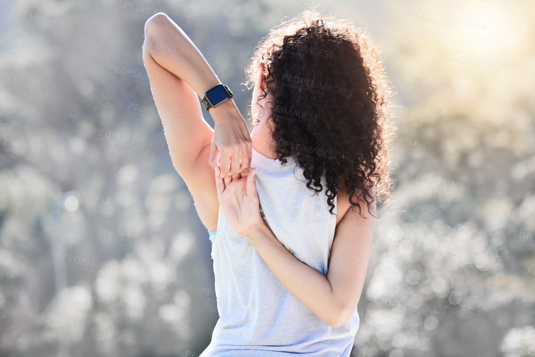 Buy stock photo Stretching, fitness and back of woman in nature for exercise, training and cardio workout with smart watch. Sports, healthy body and female person stretch arms for warm up, wellness and performance