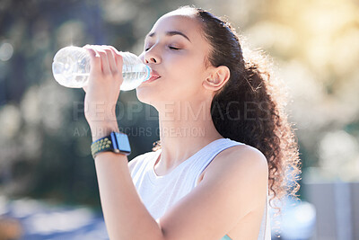 Buy stock photo Woman, fitness and drinking water in nature for sustainability after workout, running or exercise. Fit, active and thirsty female person or runner with drink for hydration, rest or break outdoors