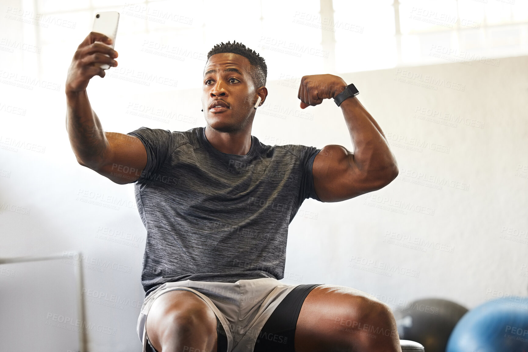 Buy stock photo Selfie, muscle flex and man for gym, fitness and workout results, progress and social media update of body goals. Bodybuilder or african person with profile picture, photography and exercise in power