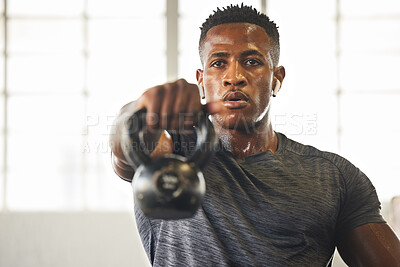 Buy stock photo Kettlebell, fitness and black man with gym workout, bodybuilder challenge and training with health and focus. Young athlete or professional person sweating for sports exercise, muscle and power goals