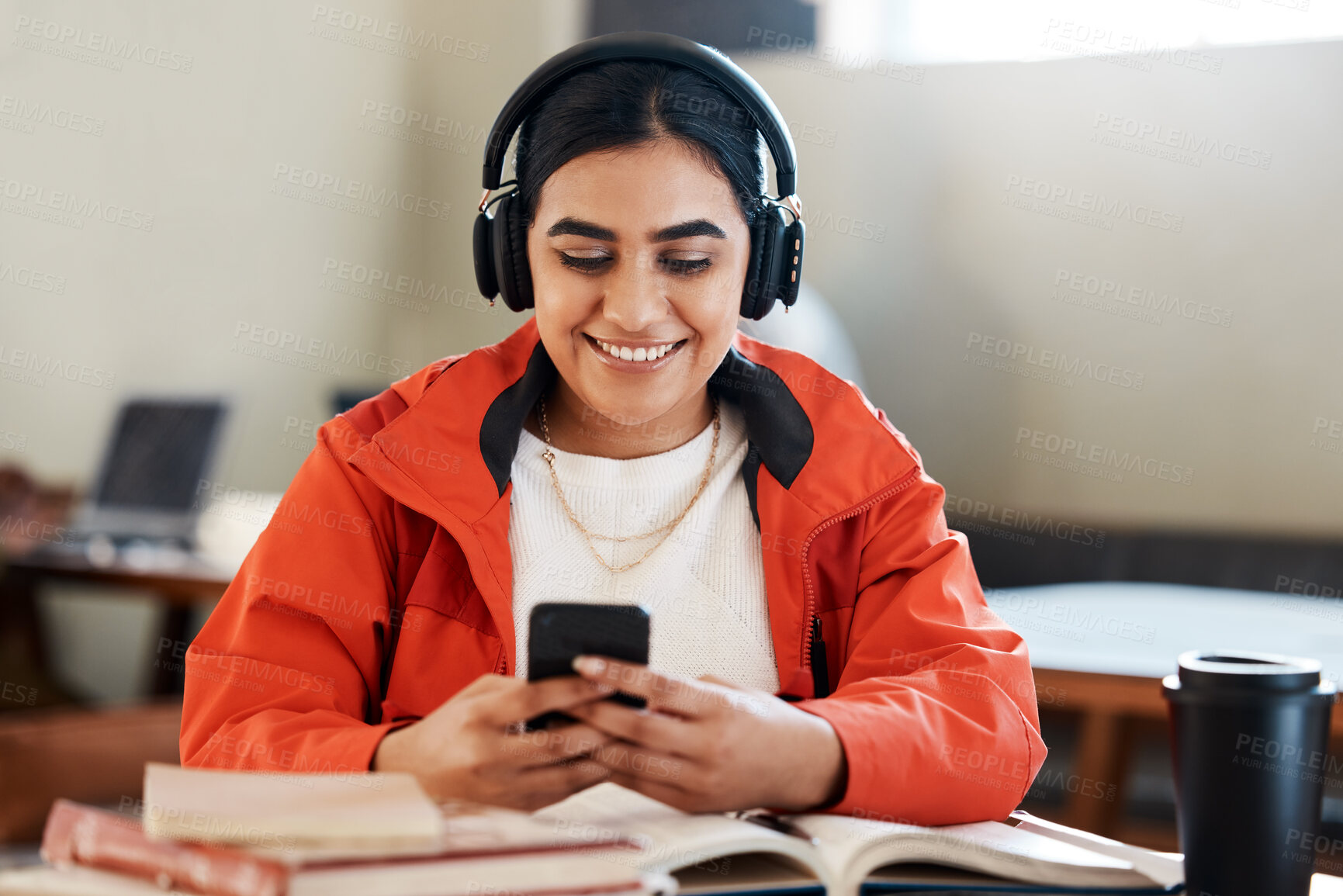 Buy stock photo University, woman and student with headphones, smartphone and typing with social media, contact and smile. Person, college and girl with headset, cellphone and research for project with connection