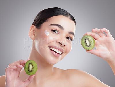 Buy stock photo Kiwi, lotion and portrait of natural woman in studio on gray background for diet, health or nutrition. Cream, fruit or skincare and face of model with fresh produce for organic dermatology or detox