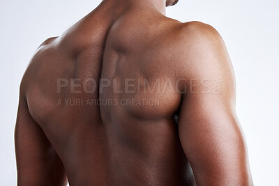 Buy stock photo Cropped shot of an unrecognizable musclar man posing in studio against a grey background