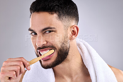 Buy stock photo Portrait, man and toothbrush in studio background for oral hygiene, cleaning mouth and medical health. Male person, dental care or whitening teeth for fresh smile, grooming and cavity prevention