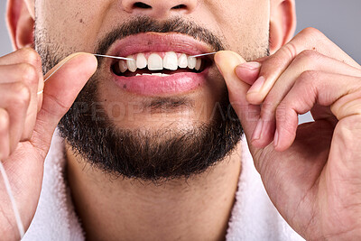 Buy stock photo Mouth, man and flossing teeth for dental health in studio isolated on a white background. Closeup, floss and male model cleaning tooth for oral wellness, hygiene and healthy product for fresh breath.