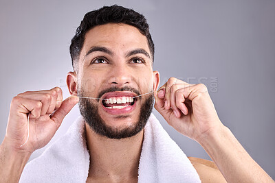 Buy stock photo Face, man and floss teeth for dental health in studio isolated on a white background. Tooth, flossing and male model cleaning for oral wellness, fresh breath and healthy hygiene to stop gingivitis.