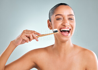 Buy stock photo Dental, thinking and woman with toothbrush in studio for oral hygiene, wellness or teeth whitening on white background. Mouth, hand and model with laugh for toothpaste, self care or morning routine 