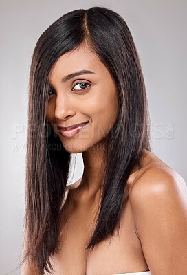 Buy stock photo Shot of a beautiful young woman posing against a grey background