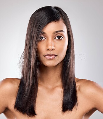 Buy stock photo Shot of a beautiful young woman posing against a grey background