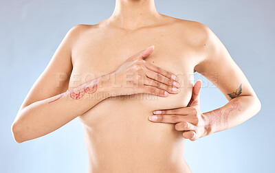 Buy stock photo Studio shot of an unrecognizable woman examining her breast