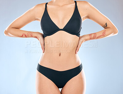 Buy stock photo Woman, underwear or studio with stomach for healthy wellness, tattoo or fashion model with confidence. Female person, blue background or underwear with relax for sport, transformation with motivation