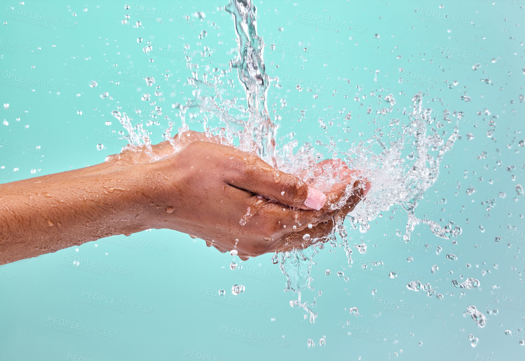 Buy stock photo Studio, splash and water in hands of woman for clean with wellness, bacteria prevention and skincare hydration. Dermatology, liquid drops and model cupping palm for shower hygiene by blue background