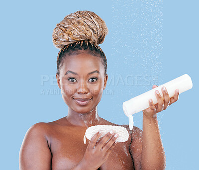 Buy stock photo Studio portrait of an attractive young woman showering against a blue background