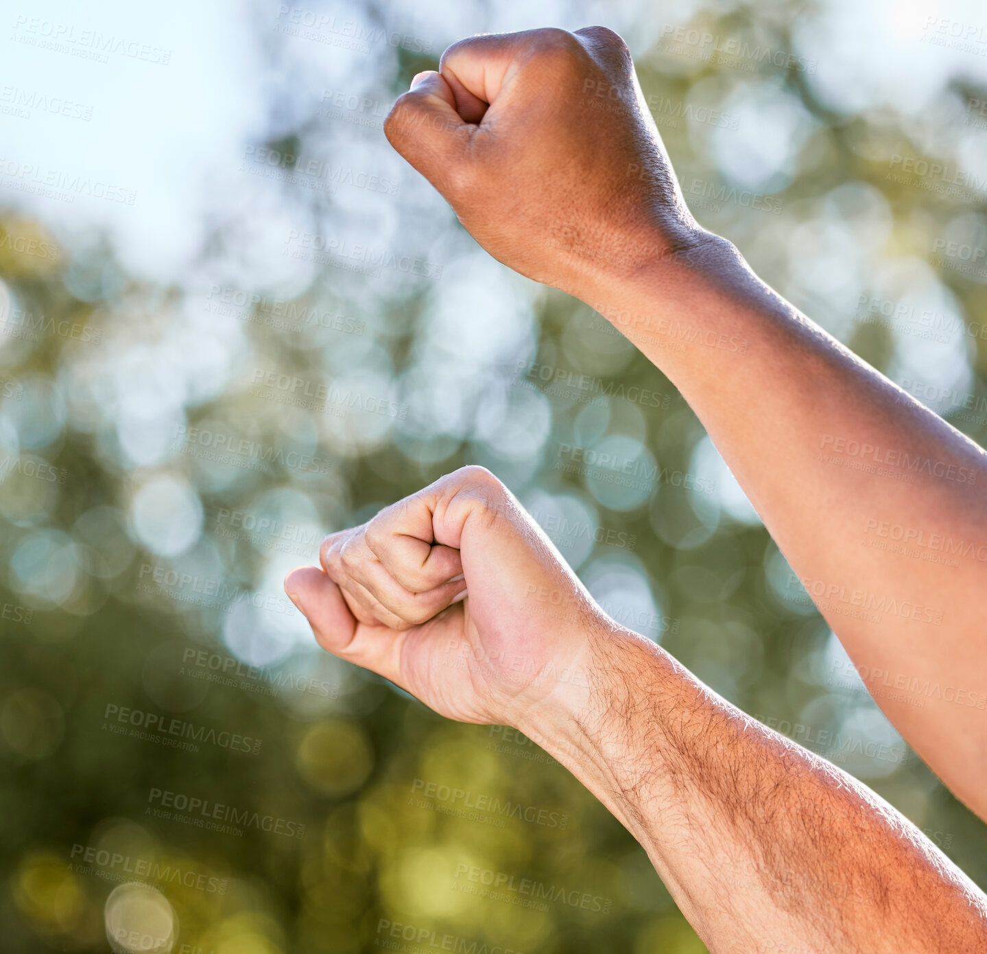 Buy stock photo Hands, protest and fist outdoor in nature on earth day for advocacy, environmental justice and global activism for awareness. People, community and bokeh with solidarity for sustainability and proud.