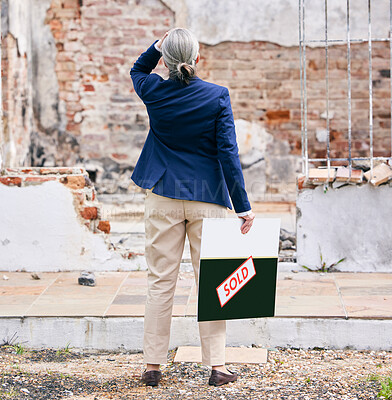 Buy stock photo Shot of a real estate standing outside a burned down property