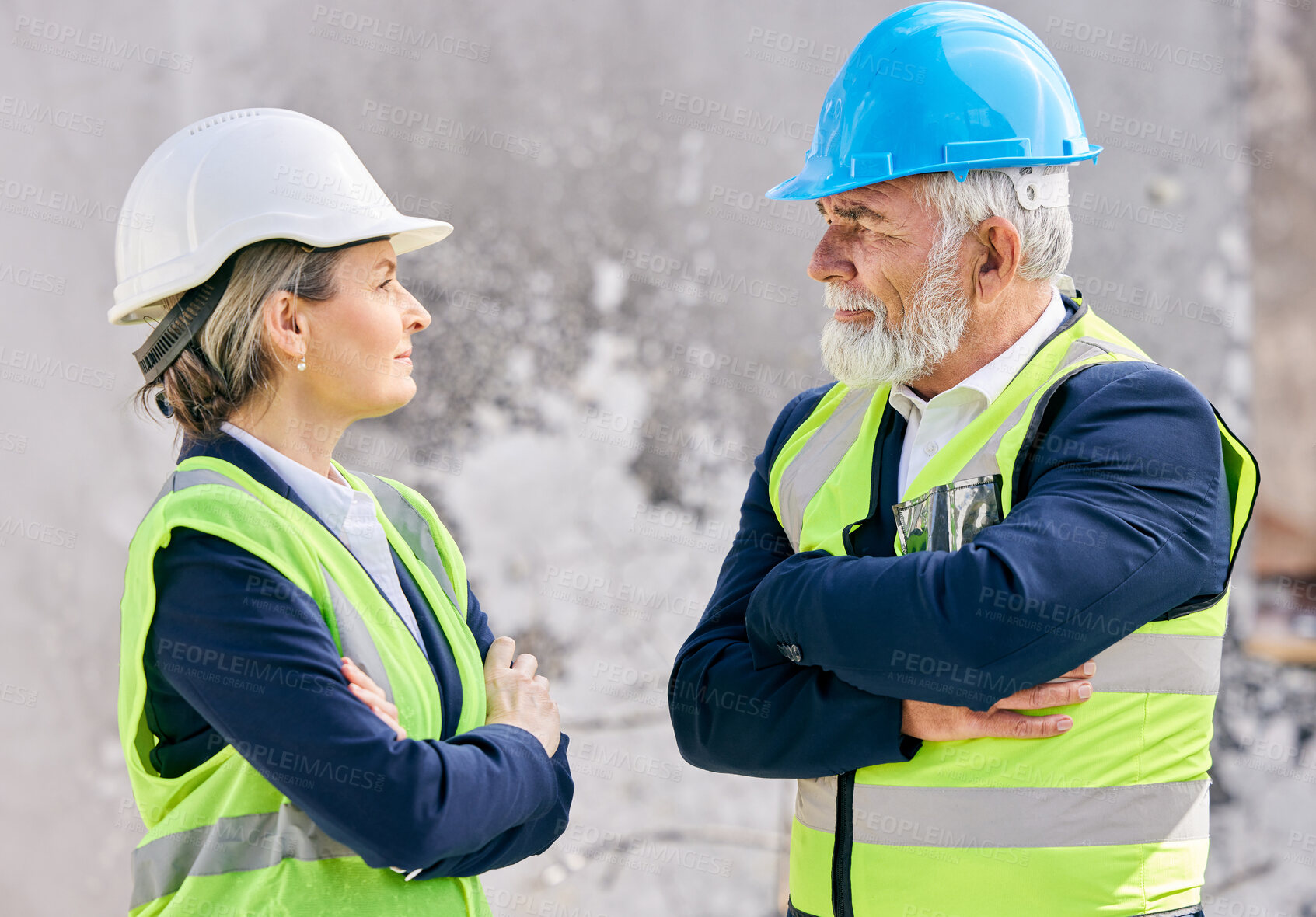 Buy stock photo Mature, engineers and arms crossed on construction site with team of foreman or supervisor in vest. Manager, boss and criticism for employee with helmet, architect or city planner with collaboration.