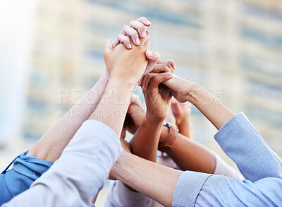 Buy stock photo Shot of a team of business people high fiving one another