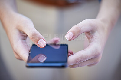 Buy stock photo Hands, phone and communication with a woman typing a text message closeup on a blurred background. Mobile, networking and social media with a female person reading a text or browsing alone outdoor