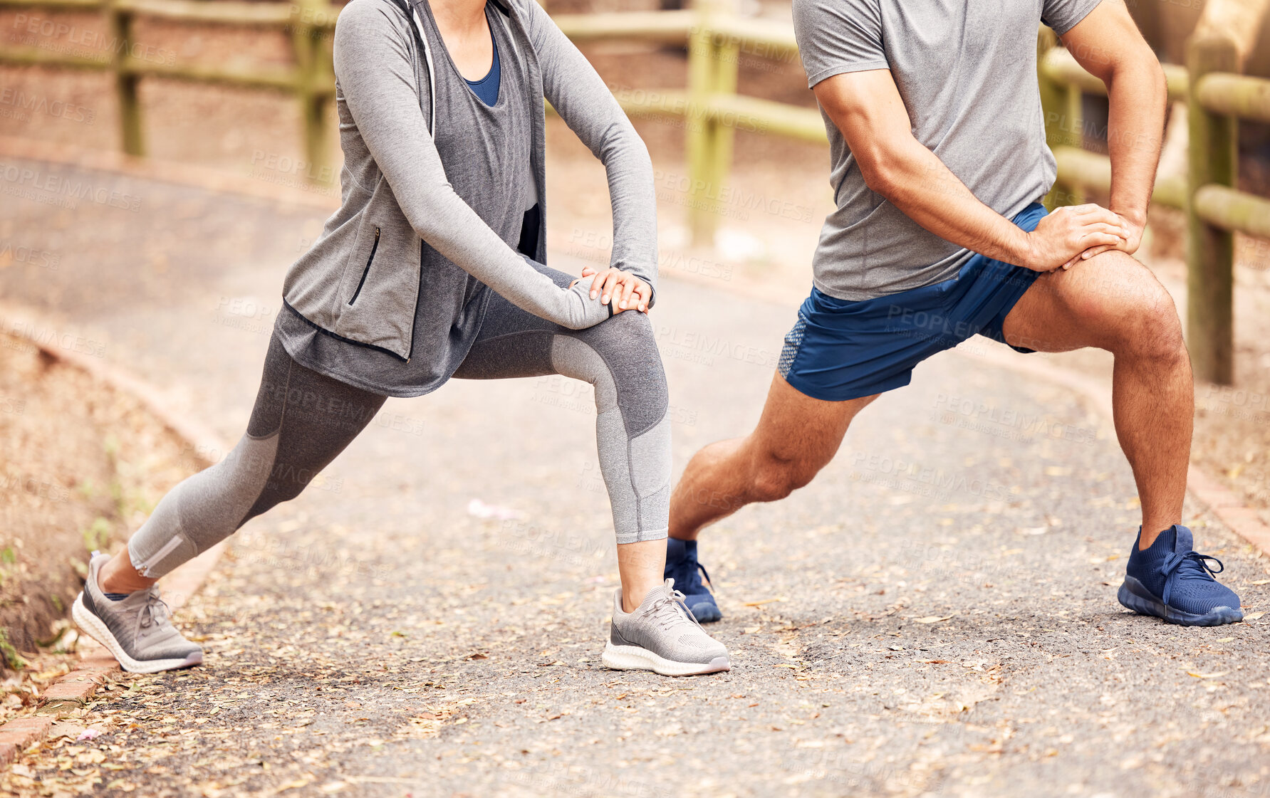 Buy stock photo Couple, stretching legs and start for exercise in outdoor, fitness and preparation for running. People, athletes and warm up for workout in park or nature, flexible and muscle relief for training