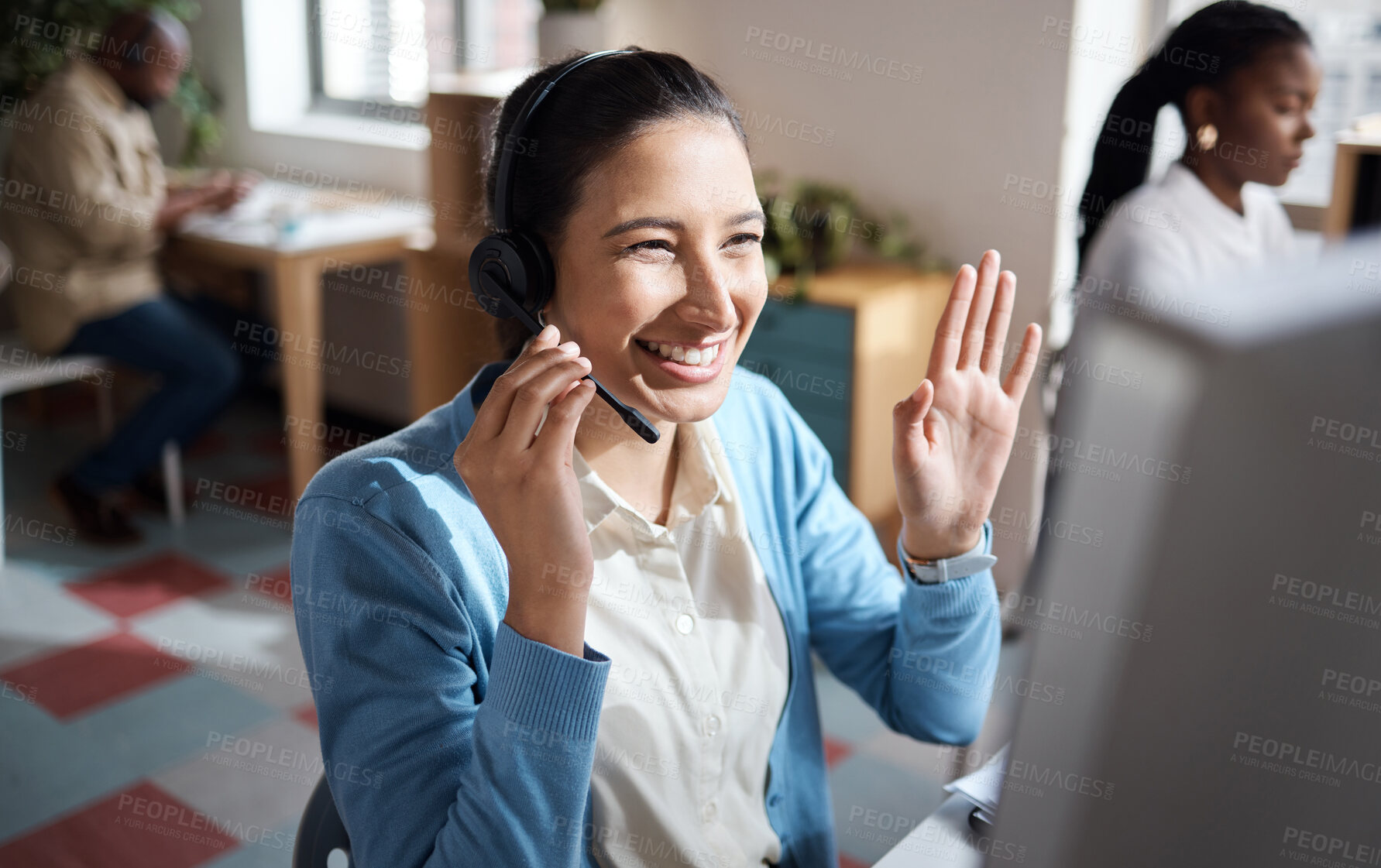 Buy stock photo Shot of a young businesswoman using a headset and computer and looking excited in a modern office