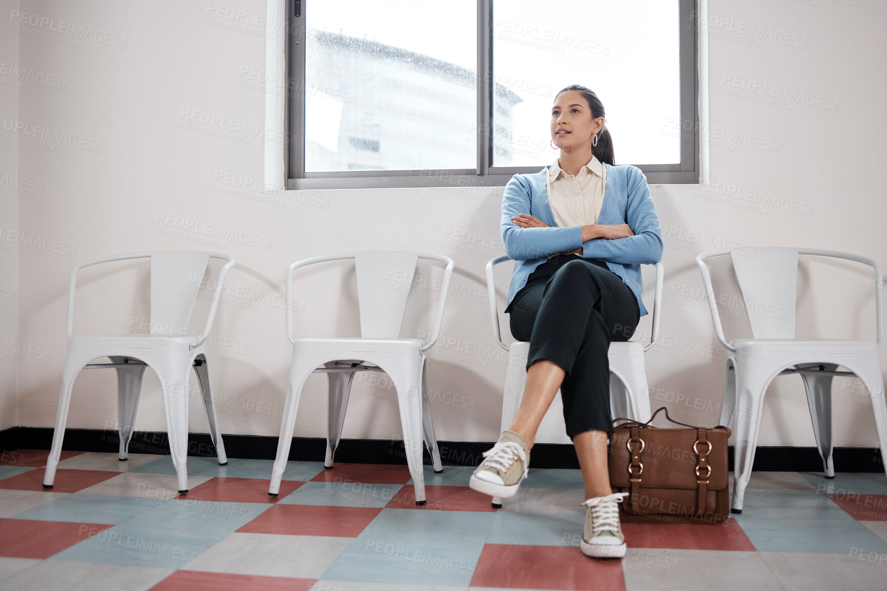 Buy stock photo Shot of a young businesswoman waiting in a line in a modern office