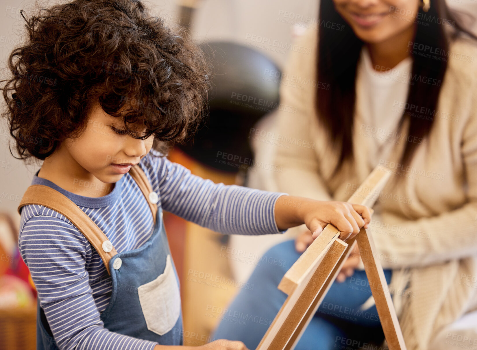 Buy stock photo Shot of a little boy drawing at home