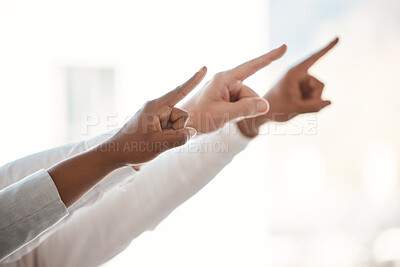Buy stock photo Cropped shot of a group of unrecognizable businesspeople pointing while standing in their office
