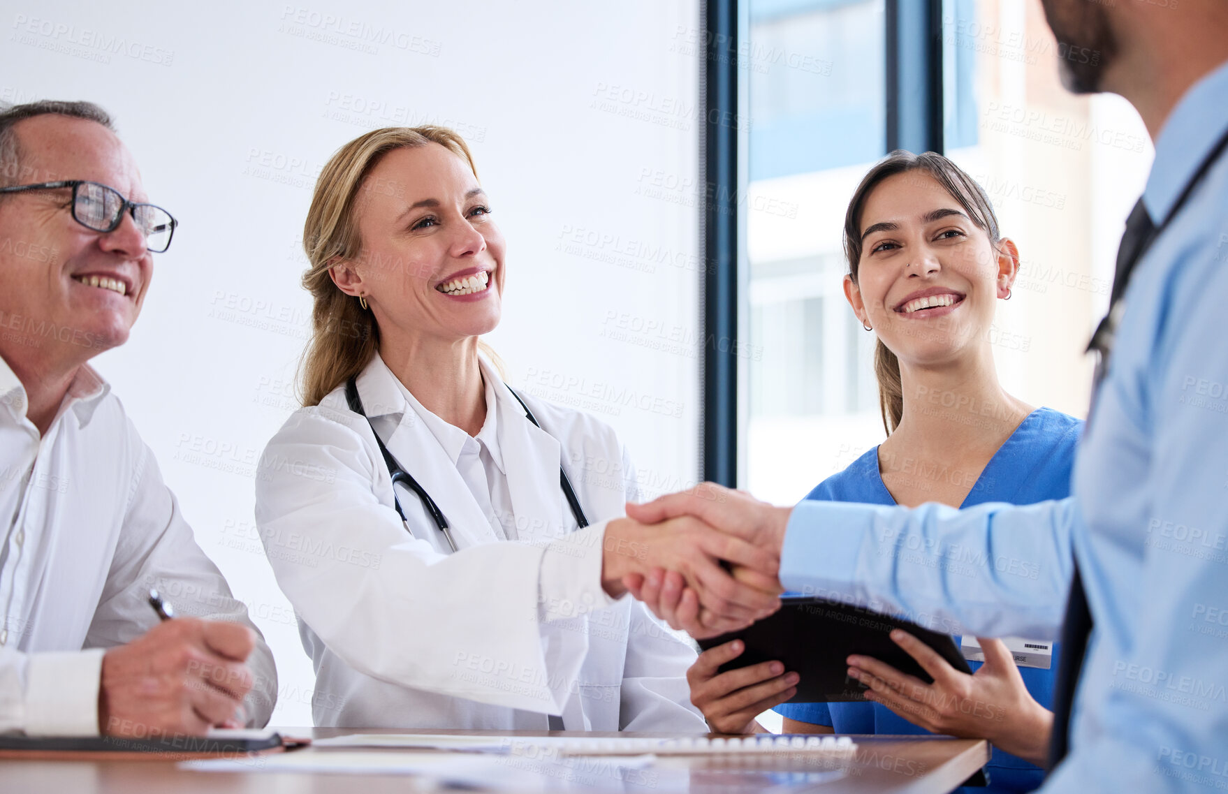 Buy stock photo Deal, meeting and doctors in office handshake, agreement or investment in healthcare. Health insurance, men and women shaking hands with medical consultant for hospital funding, business or support