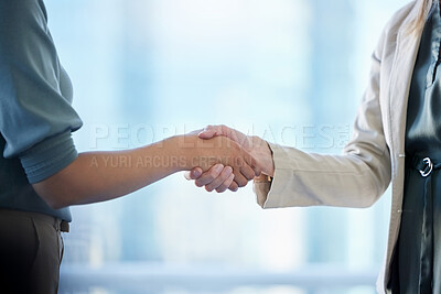 Buy stock photo Shot of two unrecognizable businesspeople shaking hands in an office