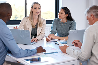 Buy stock photo Business people, collaboration and meeting with laptop in office for market research, sale trends or communication. Collaboration, employees and paperwork with discussion, feedback and brainstorming